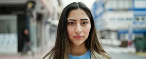 Young hispanic woman looking at the camera